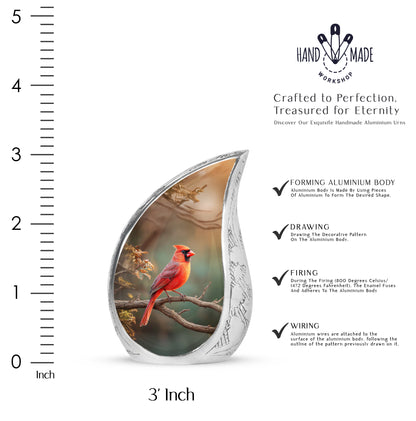 Mint Green Cardinal Cremation Urn angled view of lid and engraved motif - graceful tear-shaped urn with cardinal motif - mini keepsake memorial for portion of cremation ashes