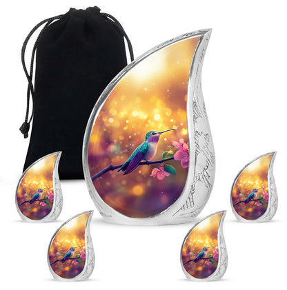Burnished Gold Hummingbird Cremation Urn side profile showing urn shape - graceful tear-shaped urn with hummingbird motif - memorial set with one large and four small urns