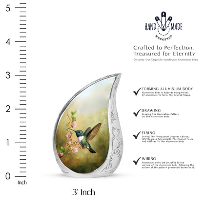 Gilded Gold Hummingbird Cremation Urn angled view of lid and engraved motif - rounded teardrop hummingbird design with delicate detail - mini keepsake memorial for portion of cremation ashes