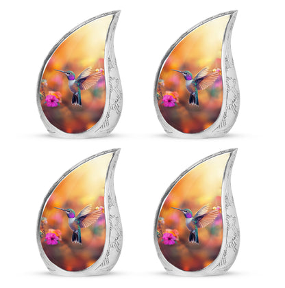 Royal Gold Hummingbird Cremation Urn close-up of engraving and surface detail - smooth teardrop contour featuring hummingbird art - 10 inch aluminum urn for cremated remains