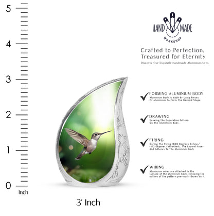 Jade Green Hummingbird Cremation Urn angled view of lid and engraved motif - rounded teardrop hummingbird design with delicate detail - mini keepsake memorial for portion of cremation ashes