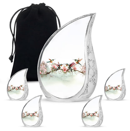 Moonlight Silver Hummingbird Cremation Urn side profile showing urn shape - smooth teardrop contour featuring hummingbird art - memorial set with one large and four small urns