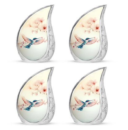 Porcelain White Hummingbird Cremation Urn close-up of engraving and surface detail - smooth teardrop contour featuring hummingbird art - 10 inch aluminum urn for cremated remains