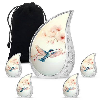 Alabaster White Hummingbird Cremation Urn side profile showing urn shape - rounded teardrop hummingbird design with delicate detail - memorial set with one large and four small urns