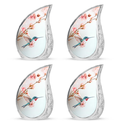 Polished Silver Hummingbird Cremation Urn close-up of engraving and surface detail - graceful tear-shaped urn with hummingbird motif - 10 inch aluminum urn for cremated remains