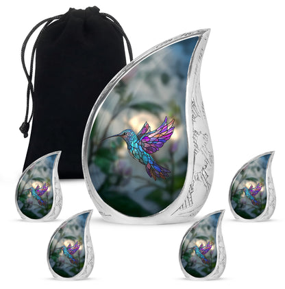 Verdant Green Hummingbird Cremation Urn side profile showing urn shape - rounded teardrop hummingbird design with delicate detail - memorial set with one large and four small urns