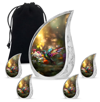 Champagne Gold Hummingbird Cremation Urn side profile showing urn shape - flowing teardrop hummingbird silhouette on curved aluminum - memorial set with one large and four small urns
