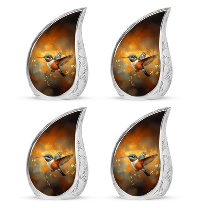 Royal Gold Hummingbird Cremation Urn close-up of engraving and surface detail - graceful tear-shaped urn with hummingbird motif - 10 inch aluminum urn for cremated remains