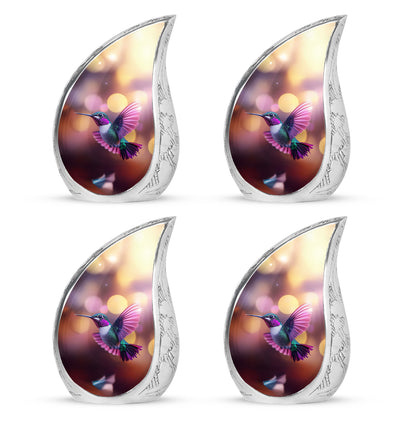 Ruby Red Hummingbird Cremation Urn close-up of engraving and surface detail - smooth teardrop contour featuring hummingbird art - 10 inch aluminum urn for cremated remains