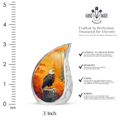 Champagne Gold Eagle Cremation Urn angled view of lid and engraved motif - flowing teardrop eagle silhouette on curved aluminum - mini keepsake memorial for portion of cremation ashes