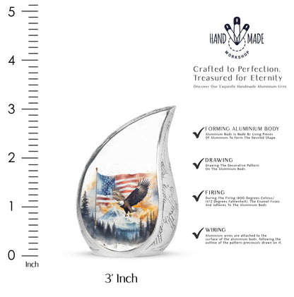 Sterling Silver Eagle Cremation Urn angled view of lid and engraved motif - rounded teardrop eagle design with delicate detail - mini keepsake memorial for portion of cremation ashes