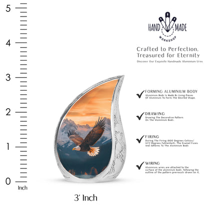 Harvest Gold Eagle Cremation Urn angled view of lid and engraved motif - graceful tear-shaped urn with eagle motif - mini keepsake memorial for portion of cremation ashes