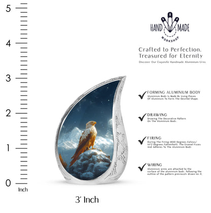 Icy Blue Eagle Cremation Urn angled view of lid and engraved motif - flowing teardrop eagle silhouette on curved aluminum - mini keepsake memorial for portion of cremation ashes