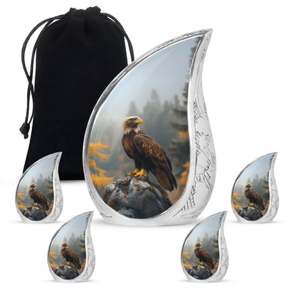 Jet Black Eagle Cremation Urn side profile showing urn shape - flowing teardrop eagle silhouette on curved aluminum - memorial set with one large and four small urns