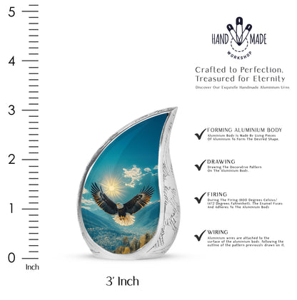 Jewel Teal Eagle Cremation Urn angled view of lid and engraved motif - flowing teardrop eagle silhouette on curved aluminum - mini keepsake memorial for portion of cremation ashes
