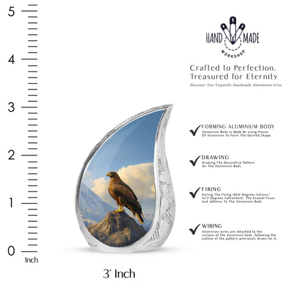 Icy Blue Eagle Cremation Urn angled view of lid and engraved motif - flowing teardrop eagle silhouette on curved aluminum - mini keepsake memorial for portion of cremation ashes