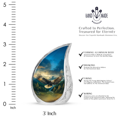 Pastel Blue Eagle Cremation Urn angled view of lid and engraved motif - flowing teardrop eagle silhouette on curved aluminum - mini keepsake memorial for portion of cremation ashes