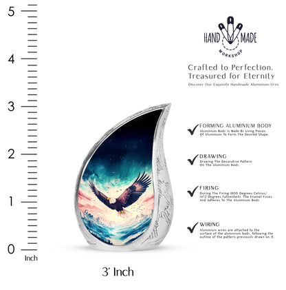 Icy Blue Eagle Cremation Urn angled view of lid and engraved motif - rounded teardrop eagle design with delicate detail - mini keepsake memorial for portion of cremation ashes