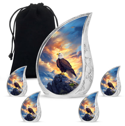 Navy Blue Eagle Cremation Urn side profile showing urn shape - flowing teardrop eagle silhouette on curved aluminum - memorial set with one large and four small urns
