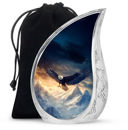 Powder Blue Eagle Cremation Urn front view showing detailed design - flowing teardrop eagle silhouette on curved aluminum - full-size 10 inch 200 cubic inch adult cremation urn
