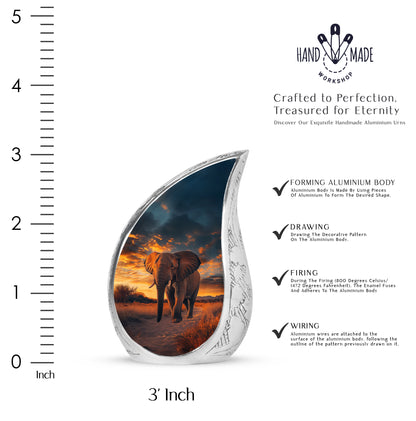 Deep Black Elephant Cremation Urn angled view of lid and engraved motif - flowing teardrop elephant silhouette on curved aluminum - mini keepsake memorial for portion of cremation ashes