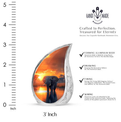 Royal Gold Elephant Cremation Urn angled view of lid and engraved motif - graceful tear-shaped urn with elephant motif - mini keepsake memorial for portion of cremation ashes