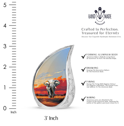 Silver Gray Elephant Cremation Urn angled view of lid and engraved motif - flowing teardrop elephant silhouette on curved aluminum - mini keepsake memorial for portion of cremation ashes