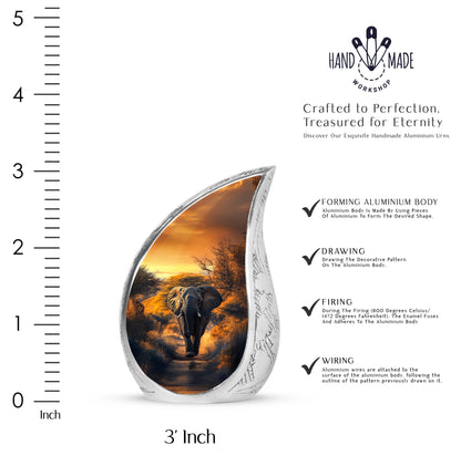 Antique Gold Elephant Cremation Urn angled view of lid and engraved motif - flowing teardrop elephant silhouette on curved aluminum - mini keepsake memorial for portion of cremation ashes