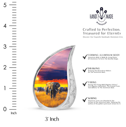 Dusty Blue Elephant Cremation Urn angled view of lid and engraved motif - flowing teardrop elephant silhouette on curved aluminum - mini keepsake memorial for portion of cremation ashes