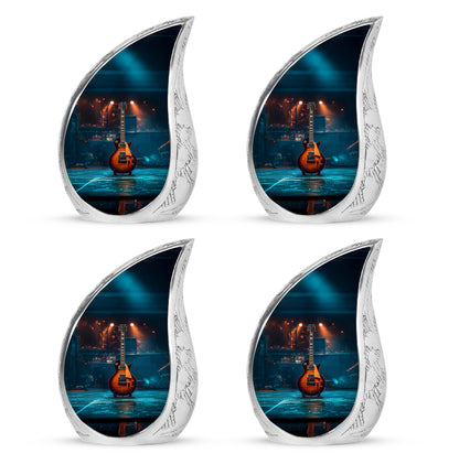 Rich Black Guitar Cremation Urn close-up of engraving and surface detail - flowing teardrop guitar silhouette on curved aluminum - 10 inch aluminum urn for cremated remains
