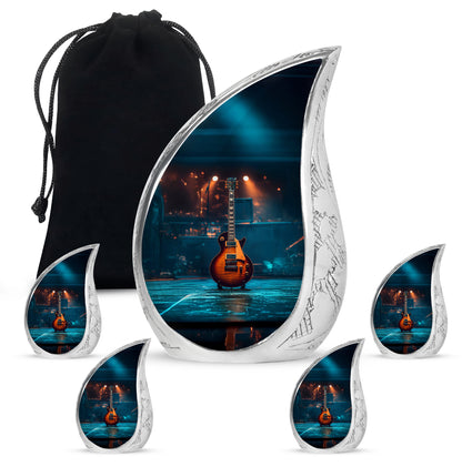 Midnight Black Guitar Cremation Urn side profile showing urn shape - graceful tear-shaped urn with guitar motif - memorial set with one large and four small urns