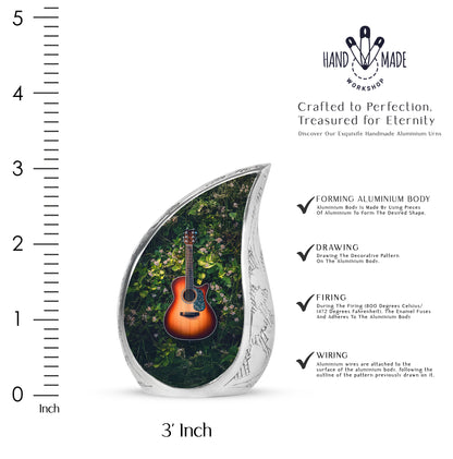 Mint Green Guitar Cremation Urn angled view of lid and engraved motif - smooth teardrop contour featuring guitar art - mini keepsake memorial for portion of cremation ashes