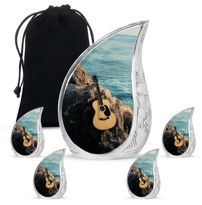 Soft Teal Guitar Cremation Urn side profile showing urn shape - rounded teardrop guitar design with delicate detail - memorial set with one large and four small urns