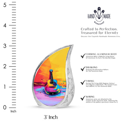Warm Gold Guitar Cremation Urn angled view of lid and engraved motif - smooth teardrop contour featuring guitar art - mini keepsake memorial for portion of cremation ashes
