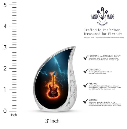 Ebony Guitar Cremation Urn angled view of lid and engraved motif - flowing teardrop guitar silhouette on curved aluminum - mini keepsake memorial for portion of cremation ashes