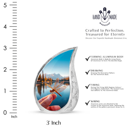 Sapphire Blue Dragonfly Cremation Urn angled view of lid and engraved motif - graceful tear-shaped urn with dragonfly motif - mini keepsake memorial for portion of cremation ashes