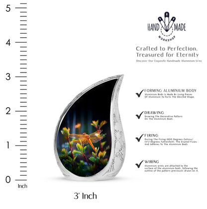 Dark Black Dragonfly Cremation Urn angled view of lid and engraved motif - smooth teardrop contour featuring dragonfly art - mini keepsake memorial for portion of cremation ashes