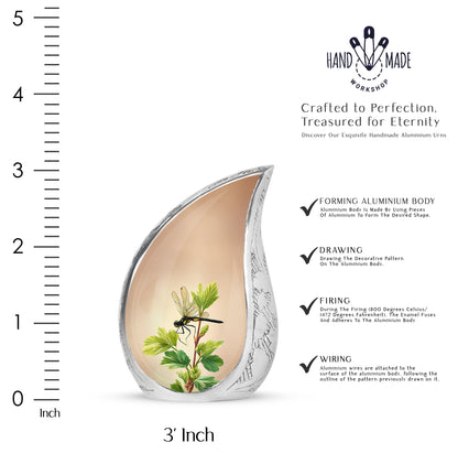Antique Gold Dragonfly Cremation Urn angled view of lid and engraved motif - flowing teardrop dragonfly silhouette on curved aluminum - mini keepsake memorial for portion of cremation ashes