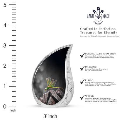 Obsidian Black Dragonfly Cremation Urn angled view of lid and engraved motif - graceful tear-shaped urn with dragonfly motif - mini keepsake memorial for portion of cremation ashes