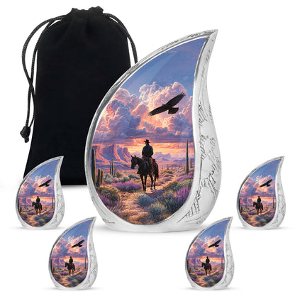 Dusty Blue Cowboy Cremation Urn side profile showing urn shape - flowing teardrop cowboy silhouette on curved aluminum - memorial set with one large and four small urns