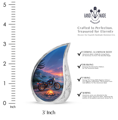 Indigo Bike Cremation Urn angled view of lid and engraved motif - flowing teardrop bike silhouette on curved aluminum - mini keepsake memorial for portion of cremation ashes