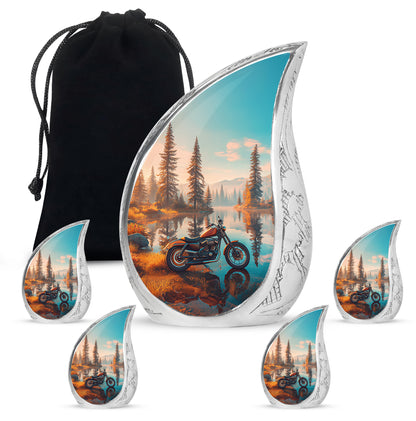 Burnished Gold Bike Cremation Urn side profile showing urn shape - graceful tear-shaped urn with bike motif - memorial set with one large and four small urns
