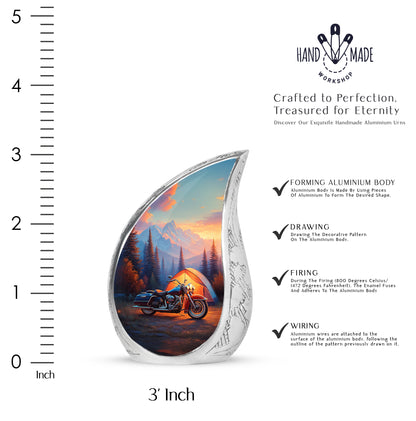 Steel Blue Bike Cremation Urn angled view of lid and engraved motif - smooth teardrop contour featuring bike art - mini keepsake memorial for portion of cremation ashes