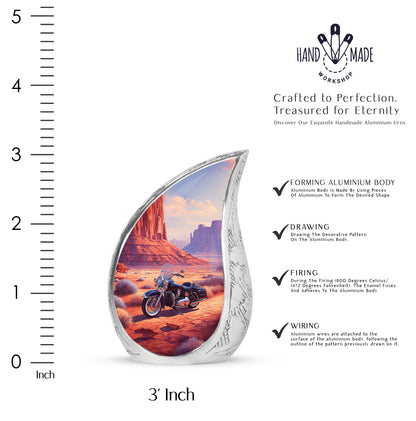 Fiery Red Bike Cremation Urn angled view of lid and engraved motif - graceful tear-shaped urn with bike motif - mini keepsake memorial for portion of cremation ashes