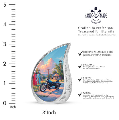 Calming Blue Bike Cremation Urn angled view of lid and engraved motif - graceful tear-shaped urn with bike motif - mini keepsake memorial for portion of cremation ashes