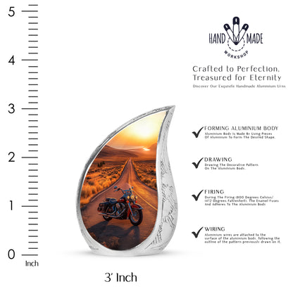 Deep Red Bike Cremation Urn angled view of lid and engraved motif - flowing teardrop bike silhouette on curved aluminum - mini keepsake memorial for portion of cremation ashes