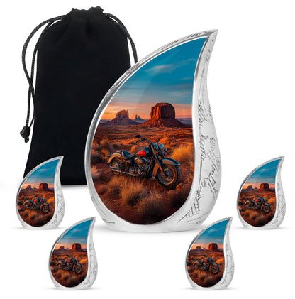 Navy Blue Bike Cremation Urn side profile showing urn shape - flowing teardrop bike silhouette on curved aluminum - memorial set with one large and four small urns
