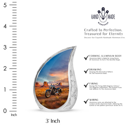 Cobalt Blue Bike Cremation Urn angled view of lid and engraved motif - graceful tear-shaped urn with bike motif - mini keepsake memorial for portion of cremation ashes