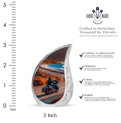Matte Gold Bike Cremation Urn angled view of lid and engraved motif - graceful tear-shaped urn with bike motif - mini keepsake memorial for portion of cremation ashes