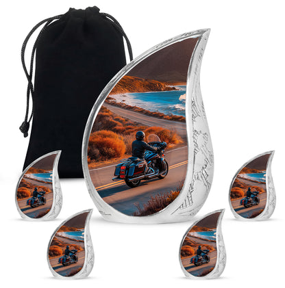 Matte Gold Bike Cremation Urn side profile showing urn shape - smooth teardrop contour featuring bike art - memorial set with one large and four small urns